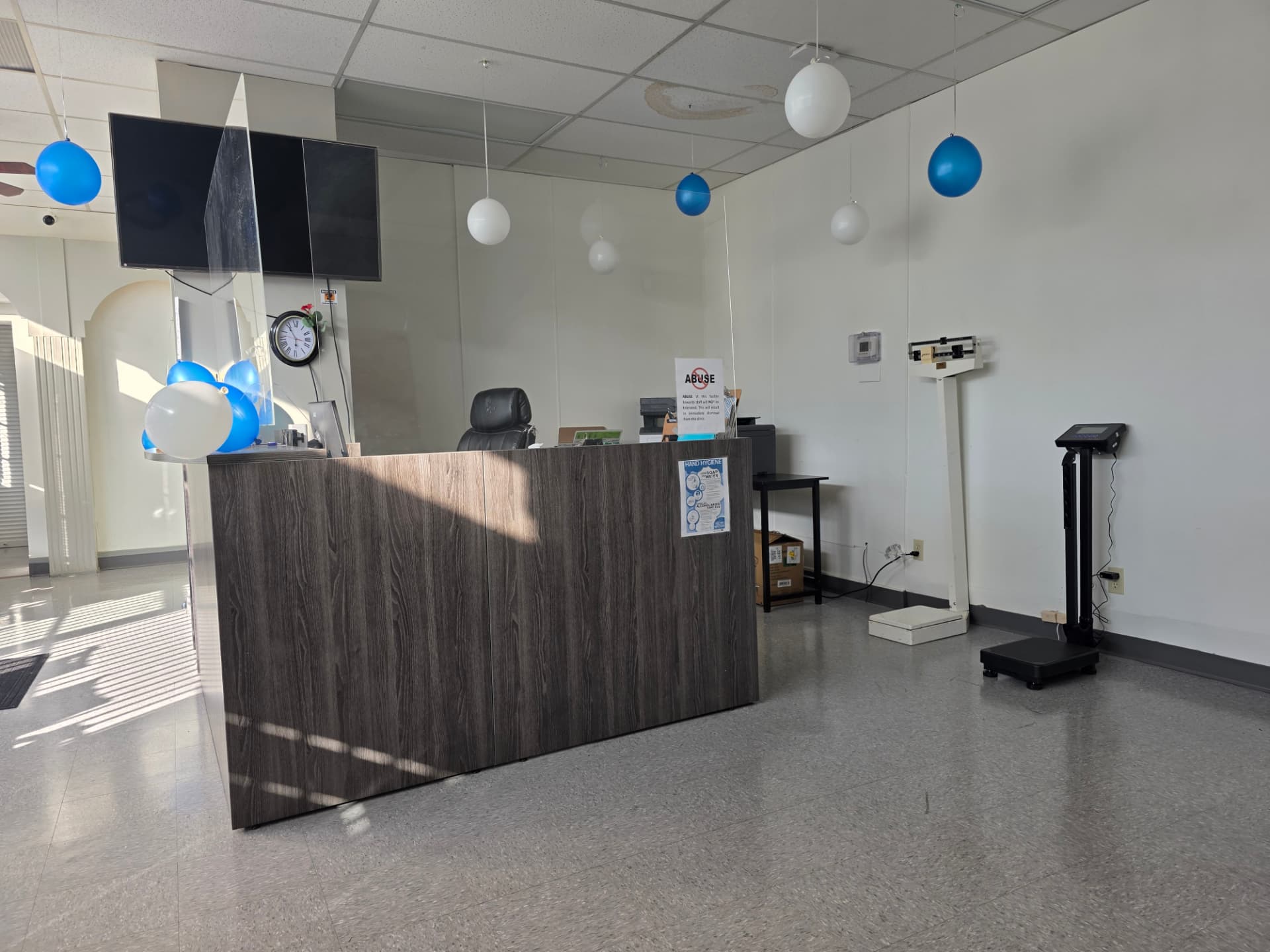 Reception desk with patient weigh scales at Jefferson Medical Centre