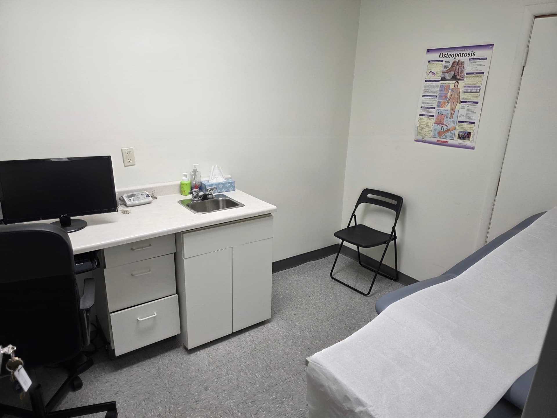 Second examination room with exam table and patient chair